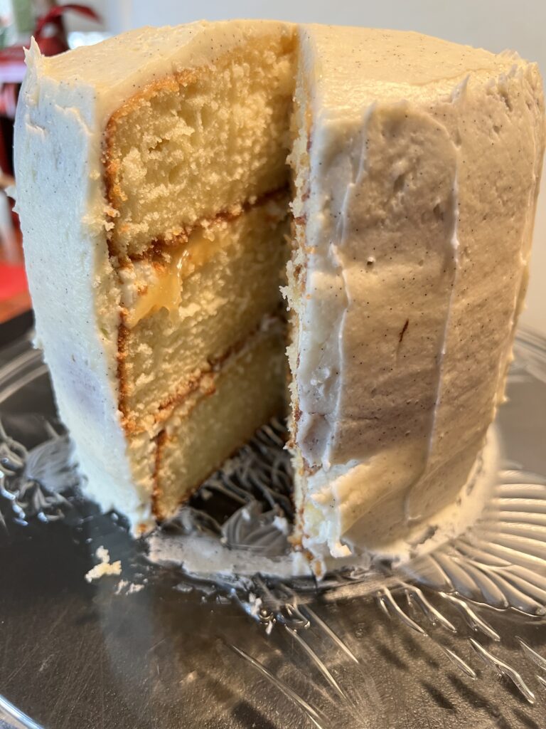 Trying out American Meringue Buttercream on a triple layer vanilla bean cake - yum! 